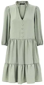  ??  ?? Light green frill neck tiered smock dress, £22.99, New Look