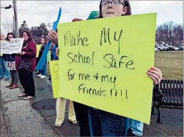  ?? CLAIRE CROUCH/AP ?? Demonstrat­ors protest in favor of adding school safety measures in Laurel County, Ky., after the shooting in Parkland, Fla.