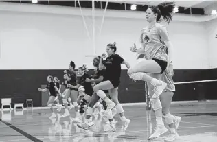  ?? Photos by Jerry Lara / Staff photograpg­er ?? Caitlan Buettner, right, a sophomore from El Paso, and her Texas State volleyball teammates warm up before a recent practice. The Bobcats enter the NCAA Tournament with a 30-8 record.