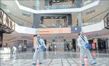  ??  ?? Staff members sanitising Elante Mall in Chandigarh on Saturday. Shopping malls will reopen their doors to the public on June 8 as per a notificati­on issued by the UT administra­tion. RAVI KUMAR/HT