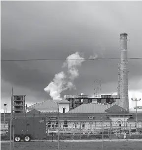  ?? AP Photo/Gerald Herbert ?? n Rain clouds gather Thursday over the New Orleans Sewerage & Water Board facility, where turbines that power pumps have failed. Gov. John Bel Edwards declared a state of emergency in New Orleans on Thursday as the city’s malfunctio­ning water-pumping...