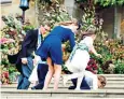  ??  ?? Prince George joins the flowers girls, left, while fellow pageboy Louis de Givenchy takes a tumble on the steps