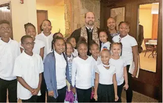  ?? [PHOTO PROVIDED] ?? The Rev. Daniel U’Ren poses for a picture with youths at Wildewood Christian Church (Disciples of Christ), where he served as guest pastor on Sept. 30.