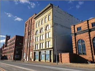  ?? CORNELIUS FROLIK / STAFF ?? The former Lotz Paper building at 607 E. Third St. will become offices and possibly ground-floor retail space.