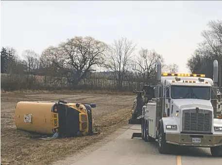  ?? DALE CARRUTHERS/THE LONDON FREE PRESS ?? A school bus carrying 40 students crashed at a rural intersecti­on in Oxford County shortly after 8 a.m. on Tuesday. Police report that several kids were taken to hospital. Most had minor injuries, but one was airlifted and reportedly critically hurt.