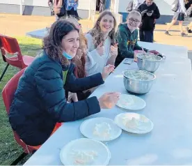  ?? ?? The 40hr Famine team running the Teacher Pie Toss. From left, Niamh Maguire, Mia Adams, Charlee Shipman and Helia Dawson.