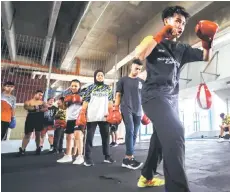  ?? Bernama photo — ?? Saba boxers take part in a training session at the Sarawak Stadium.