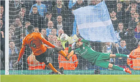  ?? REUTERS ?? Manchester City’s Claudio Bravo saves a penalty from Wolves’ Alfred N’Diaye during the shoot-out.