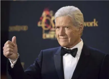  ?? RICHARD SHOTWELL - ASSOCIATED PRESS ?? Alex Trebek poses in the press room at the 46th annual Daytime Emmy Awards at the Pasadena Civic Center on Sunday, May 5, 2019, in Pasadena, Calif. Trebek has been battling cancer, but continues to host the popular show.