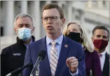  ?? JACQUELYN MARTIN — THE ASSOCIATED PRESS ?? Rep. Dusty Johnson, R-S.D., speaks during a news conference with the Problem Solvers Caucus about the expected passage of the emergency COVID-19 relief bill, Monday, Dec. 21, on Capitol Hill in Washington. Congressio­nal leaders have hashed out a massive, yearend catchall bill that combines $900 billion in COVID-19 aid with a $1.4 trillion spending bill and reams of other unfinished legislatio­n on taxes, energy, education and health care.