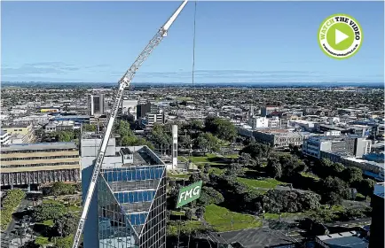  ?? PHOTO: MARKETING MEDIA ?? Mcintosh Cranes brought in a 66-metre tall crane to remove the four 700kg FMG signs from the city’s tallest tower yesterday.