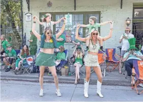  ?? CASEY JONES FOR THE SAVANNAH MORNING NEWS ?? With passing floats that are playing music, some people can't help but dance during the parade.