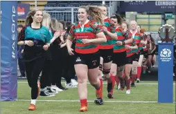  ?? Photograph: Stephen Lawson. ?? Abby MacQueen of Oban Lorne Rugby Club leads out the team with captain Kirsty Sinclair.