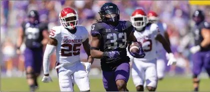  ?? (AP PHOTO/BRANDON WADE, FILE) ?? TCU is the first Big 12 team to go 12-0 since Texas did it in 2009. The Horned Frogs are also the first Big 12 team to go unbeaten in conference play since Oklahoma in 2016.