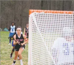  ?? STAFF PHOTO BY AJ MASON ?? North Point junior midfielder Ali Zadeh, pictured heading towards the goal, finished with all seven of her goals in the first half during Thursday’s 19-3 win over host Lackey in a SMAC Potomac Division girls lacrosse contest.