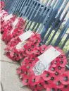  ??  ?? Wreaths of poppies at Filey War Memorial