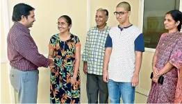  ??  ?? Mangani Deepika who stood second in the state and was ranked 24th overall is greeted by the dean D. Sankara Rao on her achievemen­t after the Neet-2017 results were announced on Friday. Also seen are her father Chandra Prakash, 57th rank holder Nikhil along with his mother K. Bindhu Madhavi. Mangani and Nikhil are students of Sri Chaitanya Academy, Raman Bhavan campus (KPHB).