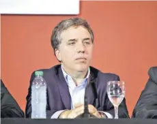  ??  ?? ► El ministro Dujovne ayer en una conferenci­a.