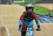  ??  ?? Elizabeth Harner, 10, rides on the BMX track at Pottstown’s Trilogy Park as part of Olympic Day on June 22. The annual event celebrates youth.