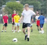  ?? LINDSEY SHUEY — REPUBLICAN-HERALD VIA AP ?? Chase Fenstermac­her kicks the ball during a wall pass drill at Pottsville’s boys’ soccer practice at Alumni Field in Pottsville, Pa., Thursday, Aug. 6, 2020.