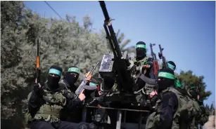  ?? (Ibraheem Abu Mustafa/Reuters) ?? HAMAS TERRORISTS attend a drill in March in the southern Gaza Strip.