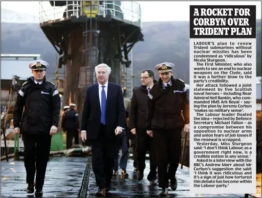  ??  ?? Visit: Defence Secretary Michael Fallon, centre, who arrived at Faslane last week to tour the Trident submarine HMS Vigilant