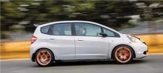  ??  ?? Far left: The cross-brace increases chassis rigidity. Left: That’s a squeeze! Bottom: Race seats and a four-point harness elevate the driving experience