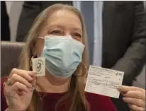  ?? MARK LENNIHAN — THE ASSOCIATED PRESS ?? Patient Susan Maxwell Trumble displays her vaccinatio­n card after being inoculated with the Johnson & Johnson COVID-19 vaccine at South Shore University Hospital, Wednesday, March 3, in Bay Shore, N.Y.