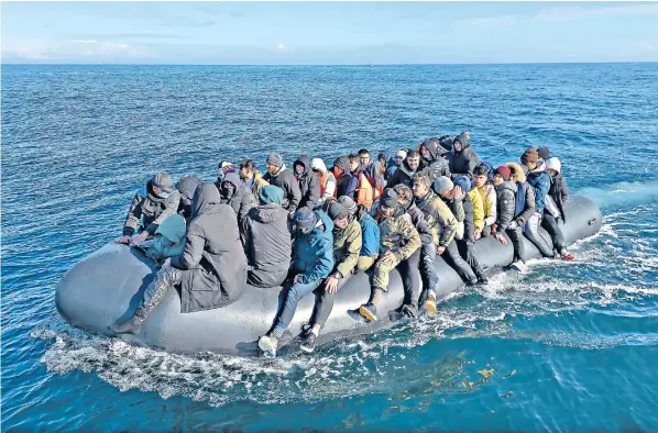  ?? ?? A dinghy carrying around 65 migrants crosses the English Channel. Monday was the busiest day of the year so far for Channel crossings, with 401 migrants arriving in the UK on small boats, according to official figures