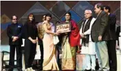  ??  ?? Wrestlers Geeta and Babita Phogat being honoured with Gaurav Samman at Pravasi Haryana Divas 2017 at Gurugram on Tuesday