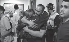  ??  ?? Eduardo Salazar, a member of the Chacao district’s police, celebrates his release. (Photo: Reuters)