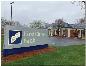  ?? (AP/Jonathan Drew) ?? A First Citizens Bank sign marks a branch location in Durham, N.C., on Monday.