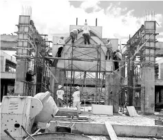 ??  ?? Work in progress at the new St Catherine Laboure church at Kg Dimbaan, Putatan.