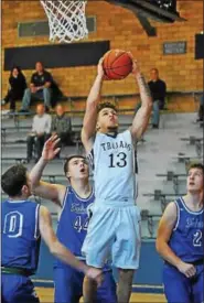  ?? PHOTOS BY BARRY TAGLIEBER - FOR DIGITAL FIRST MEDIA ?? Pottstown’s Aaron Diamond (13) drives to the basket while Lower Dauphin’s Brady Wilson, Brian Swist and Will Bowen defend.