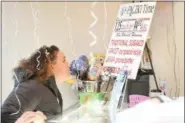  ?? ERIC BONZAR — THE MORNING JOURNAL ?? Jadera Thomas, of Elyria, mulls over the multiple flavors of paczki before placing her order at Kiedrowski’s Simply Delicious Bakery, 2267 Cooper Foster Park Road, on Feb. 28.