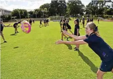  ??  ?? Imogen Saal is all smiles as she shows off her handball skills at The Glennie School.