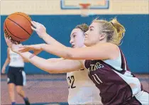  ?? JULIE JOCSAK THE ST. CATHARINES STANDARD ?? Josee Severin of the St. Paul Patriots and Julie Manlow of the Saint Michael Mustangs fight for the ball.