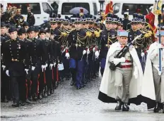  ?? Reuters ?? Servicemen arrive to take part in a commemorat­ion ceremony for Armistice Day in Paris yesterday.