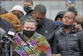  ?? Jim Mone/Associated Press ?? Katie Wright, left, the mother of Daunte Wright, and other family and friends gather during a news conference Tuesday in Minneapoli­s. Daunte Wright, 20, was shot and killed by police Sunday after a traffic stop in Brooklyn Center, Minn. Protesters rally in East Liberty over Daunte Wright’s death, Local, B-1