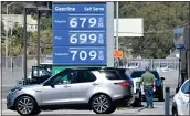  ?? ?? A car pulls out of a Chevron gas station in Mill Valley on Friday.