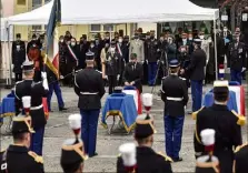  ?? (Photo EPA) ?? Le ministre de l’Intérieur, Gérald Darmanin, a décoré les trois gendarmes à titre posthume lors de l’hommage national qui leur a été rendu, hier, à Ambert (Puy-de-Dôme).