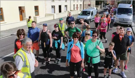  ?? Walkers taking part in the Jamie Wrenn Mike Deane Memorial walk for Recovery Haven pass through Blennervil­le. Photo by John Cleary ??