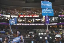  ?? JOSH HANER / THE NEW YORK TIMES ?? Divisions between supporters of Hillary Clinton and Bernie Sanders are shown in July 2016 at the Democratic National Convention in Philadelph­ia. Democratic Party officials, desperate to present a unified front in advance of the all-important 2018...