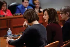  ?? The Associated Press ?? ■ From left, Sloan Forbush listens as her mother, Krista Grettenbee­rger, mother of Michigan State University shooting survivor Troy Forbush, gives testimony at the House Judicial Committee hearing on March 8 at the House Office Building in Lansing, Mich. Michigan Democrats are poised to bring an 11-bill package to the Legislatur­e this week that would implement safe storage laws, universal background checks and extreme risk protection orders, also known as red flag laws. A February mass shooting at MSU pushed Democrats to act fast on legislatio­n they had already planned to prioritize.