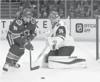  ??  ?? Vancouver Canucks forward Sam Gagner takes a shot on net as Arizona Coyotes goaltender Darcy Kuemper makes the save during the first period. The two teams took their preseason play to Kelowna on Saturday. The game was still in progress at press time.