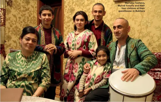  ??  ?? Martaba Tosheva, Murod Yusufiy and their four children at their guesthouse in Bukhara