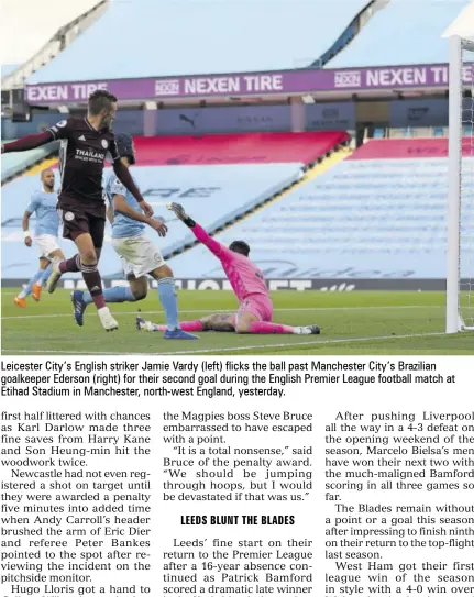  ?? LEEDS BLUNT THE BLADES ?? Leicester City’s English striker Jamie Vardy (left) flicks the ball past Manchester City’s Brazilian goalkeeper Ederson (right) for their second goal during the English Premier League football match at Etihad Stadium in Manchester, north-west England, yesterday.