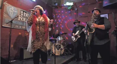  ?? JOE RONDONE/THE COMMERCIAL APPEAL ?? Charlotte Taylor & Gypsy Rain plays at Coyote Ugly during the 35th Internatio­nal Blues Challenge on Beale Street on Jan. 24, 2019.