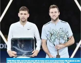  ??  ?? PARIS: Winner USA’s Jack Sock (R) poses with the trophy next to second placed Serbia’s Filip Krajinovic (L) after the final of the ATP World Tour Masters 1000 indoor tennis tournament yesterday in Paris. — AFP