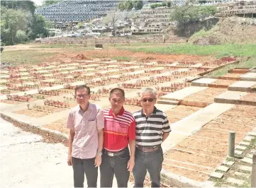  ??  ?? Tan (left) and Jeffrey (centre) at the Empire Paradise Christian Memorial Park, where more than 300 lots have been completed and ready for booking by Christians of all denominati­ons.